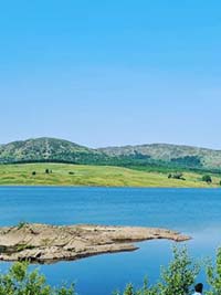 Scenic photo of loch and countryside near Dumfries