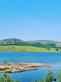 Scenic photo of loch and countryside near Dumfries