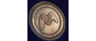 Close up image of a bronze Microbiology Society Medal