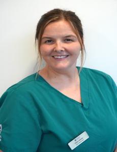 Headshot image of Karen Holmes in green scrubs