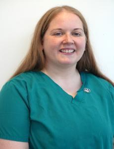 Headshot image of Jo Hatfield in green scrubs