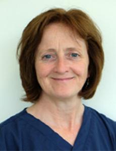 Head shot of Sandra Corr wearing blue scrubs