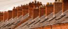 UK housing - red brick terrace with chimneys