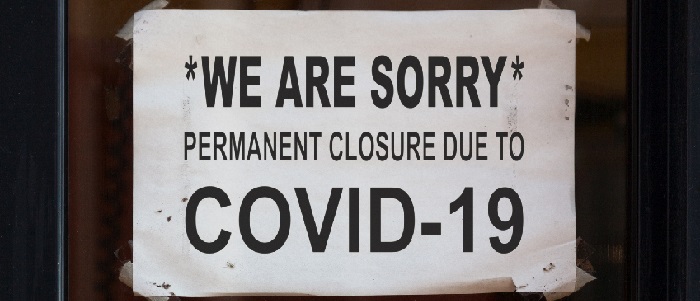 Sign in shop window displaying message