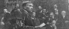 Black and white newspaper photo of John Maclean speaking from the dock in court with a paper in his hand Source: Wikimedia https://commons.wikimedia.org/wiki/File:Maclean_trial_1918.jpg
