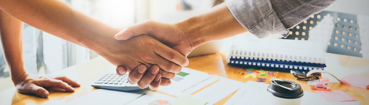 Image of Successful businessmen partnership handshaking after acquisition. Meeting for sign contracts and Group support concept.