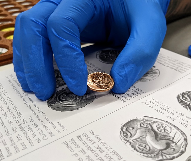 An image of a Celtic British Coin and the paper catalogue of the coin