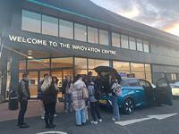 Students gather outside an Arnold Clarke building