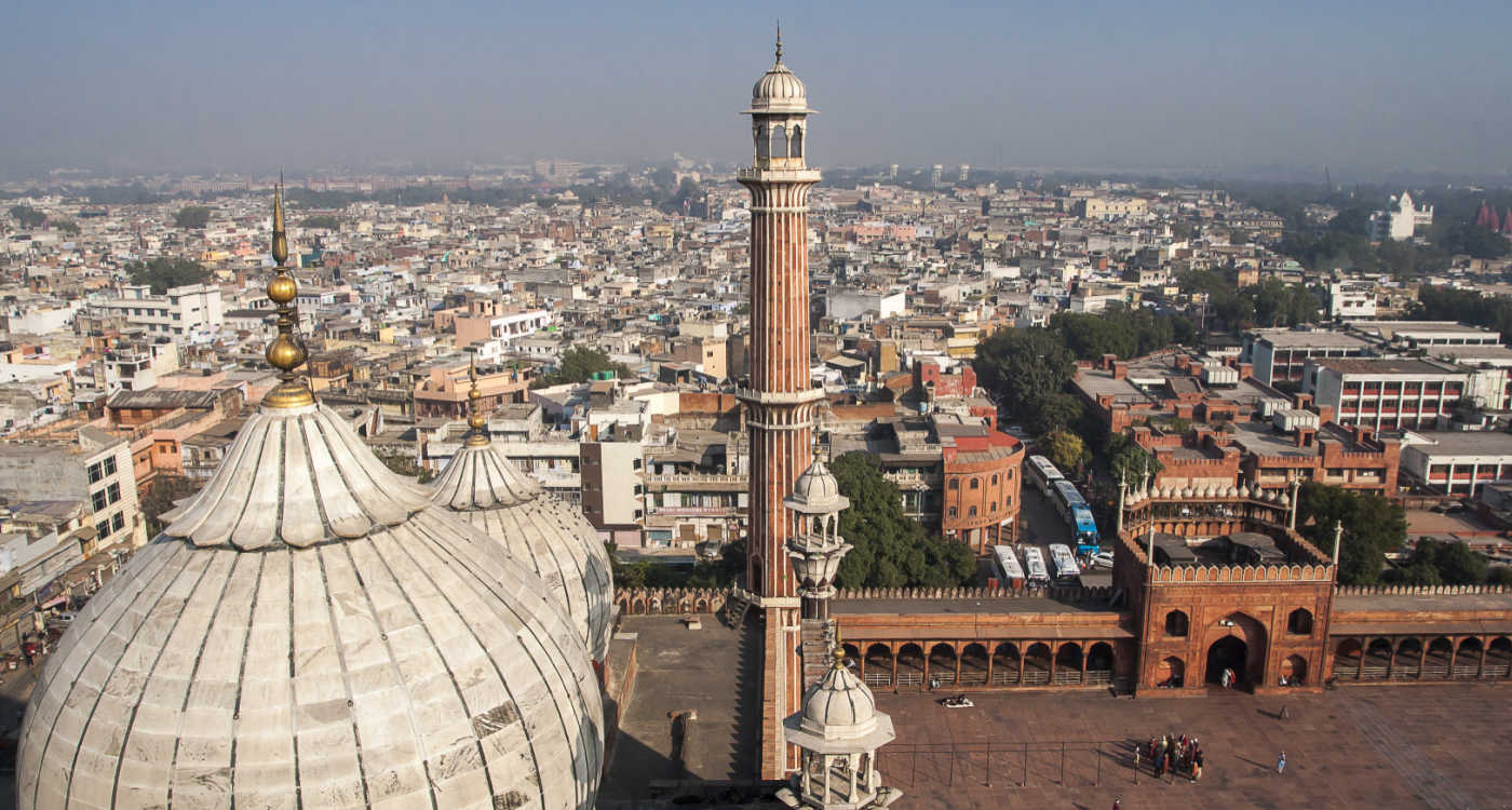 Dome an minaret of Jama Masjid Mosque with the city of Delhi in the background [Photo: Shutterstock]