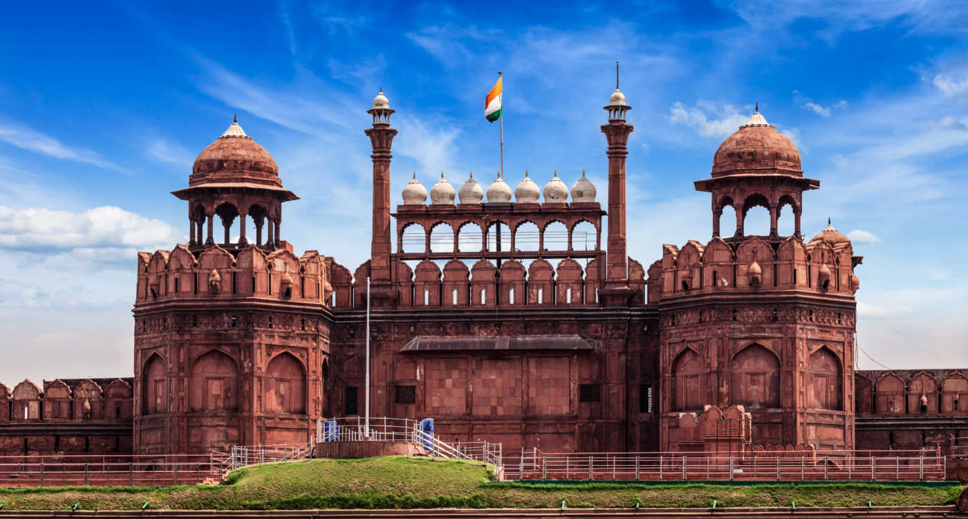 The Red Fort with an Indian flag flying against blue sky [Photo: Shutterstock]