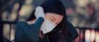 A young Chinese woman wearing a medical face mask. Source: Kay Lau on Unsplash  https://unsplash.com/photos/woman-in-black-sweater-covering-her-face-with-her-hands-vvgSoo6fvXM