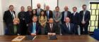 Image of Professor Anton Muscatelli, Professor Christopher Loughrey and members of CityU with signed documents