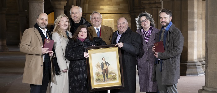 An image of the full team of the Centre for Robert Burns Studies in the Cloisters. Credit Martin Shields