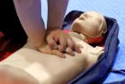 Image show young person performing CPR on Dummy