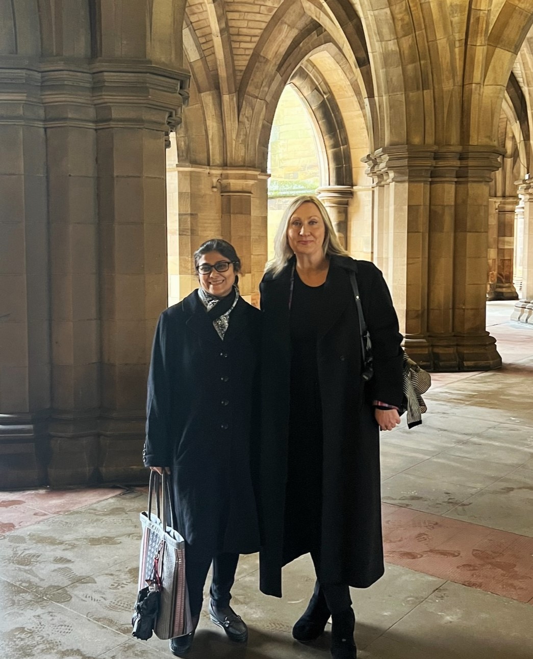 Tejshvi Jain and Maggie McColl at university cloisters.