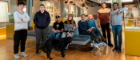 The CSI group with research and testing collaborators with the robot dog and a real dog
