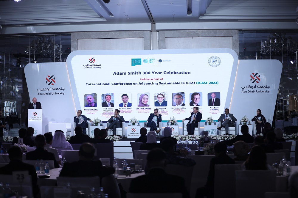 Panel and speaker at the Abu Dhabi University event with back of the audiences heads Source: Amy Laux