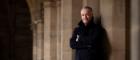 Andrew O'Hagan in the University of Glasgow's cloisters. Photo credit Martin Shields