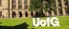 Large UofG letters on the grass in the East Quadrangle of the Gilbert Scott Building, University of Glasgow