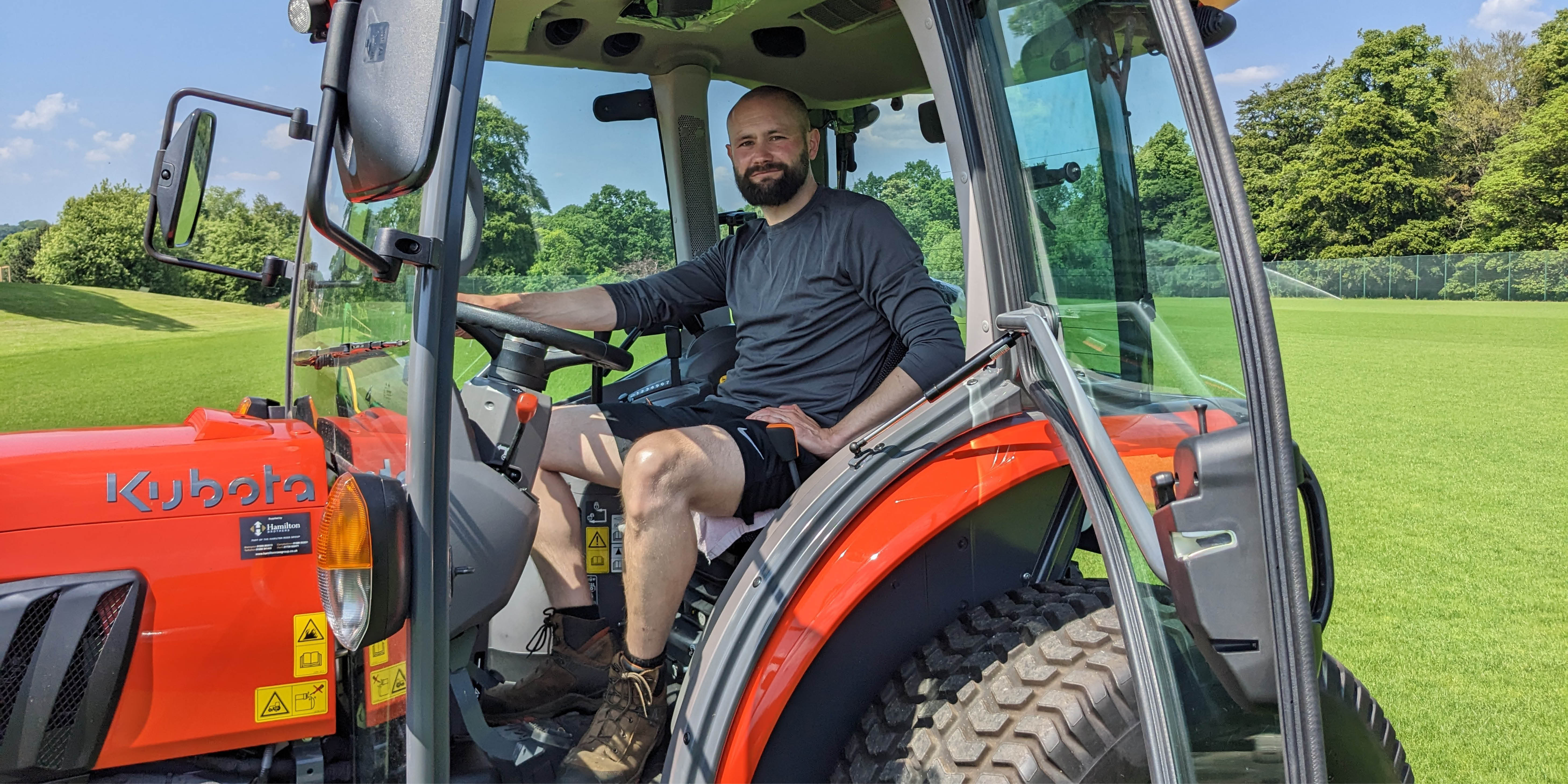 UofG staff member sitting in a tractor
