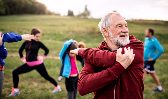 A group of people exercising outdoors