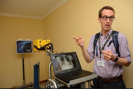 photo of Professor Peter MacPherson at a laptop