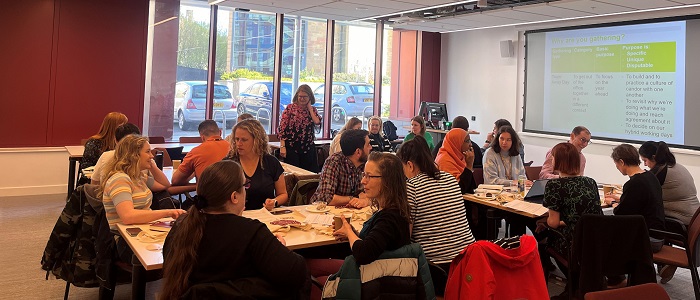 People discussing at the Art of Gathering workshop