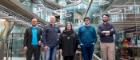 Photo of five people standing in an atrium of a modern building. Left to right: Professor Ben Colburn; Dr Derk Brown; Professor Fiona Macpherson; Professor Neil McDonnell and Calum Hodgson photographed in the University of Glasgow ’ s Advanced Research Centre (ARC). Photo credit: Martin Shields