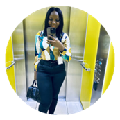 A graduate takes a selfie in a lift.