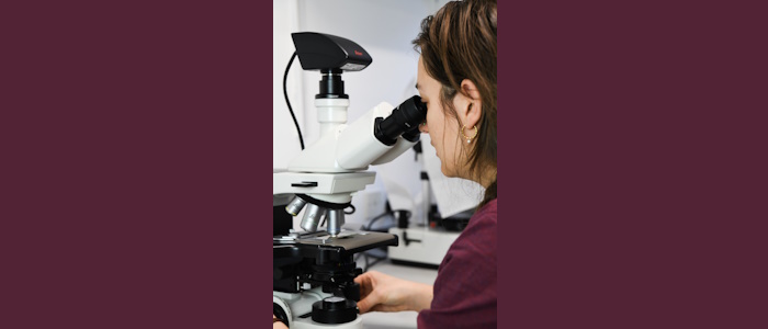 woman at microscope @Gala Morris