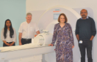 A group photo in front of the 7 Tesla MRI Scanner