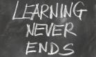 Text learning never ends written on a chalkboard