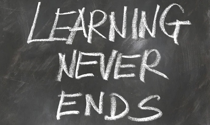 Text learning never ends written on a chalkboard