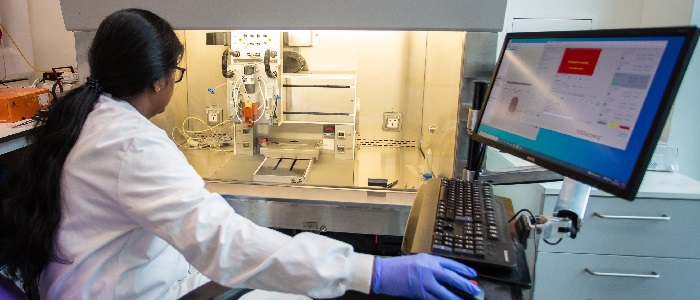 Biomedical engineering researcher using computer in lab