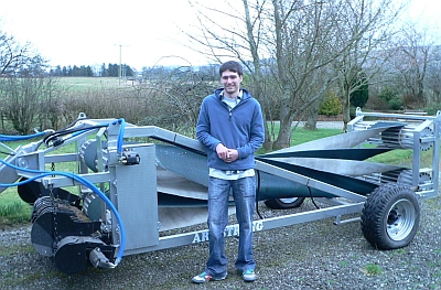 Gavin Armstrong with his hay swath inverter.