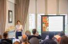 An expert presenting on digital health evaluation to a room of people