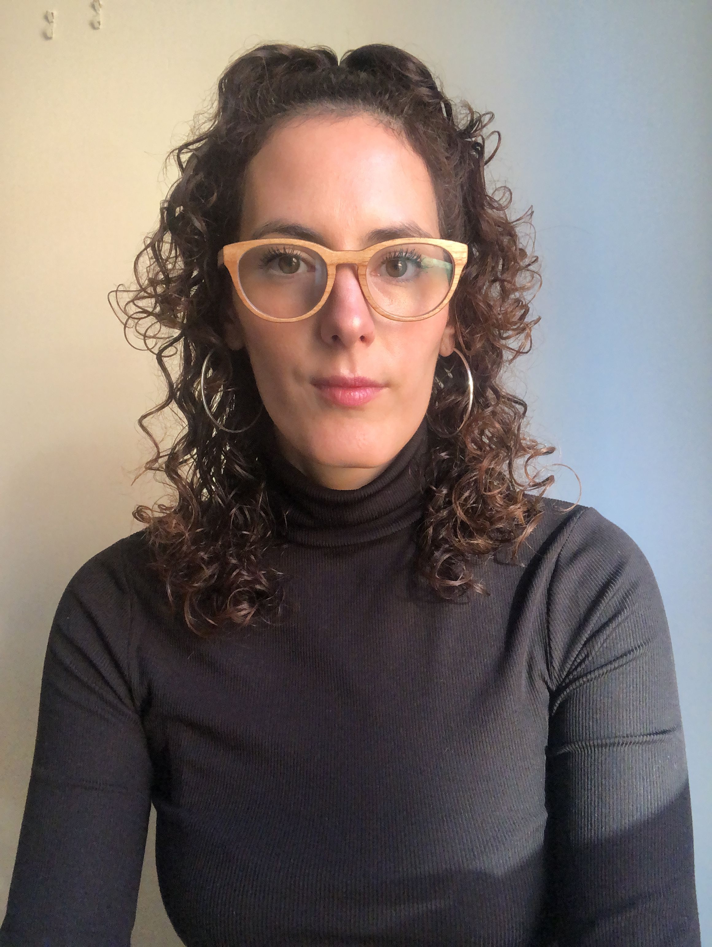 A portrait of a woman in glasses