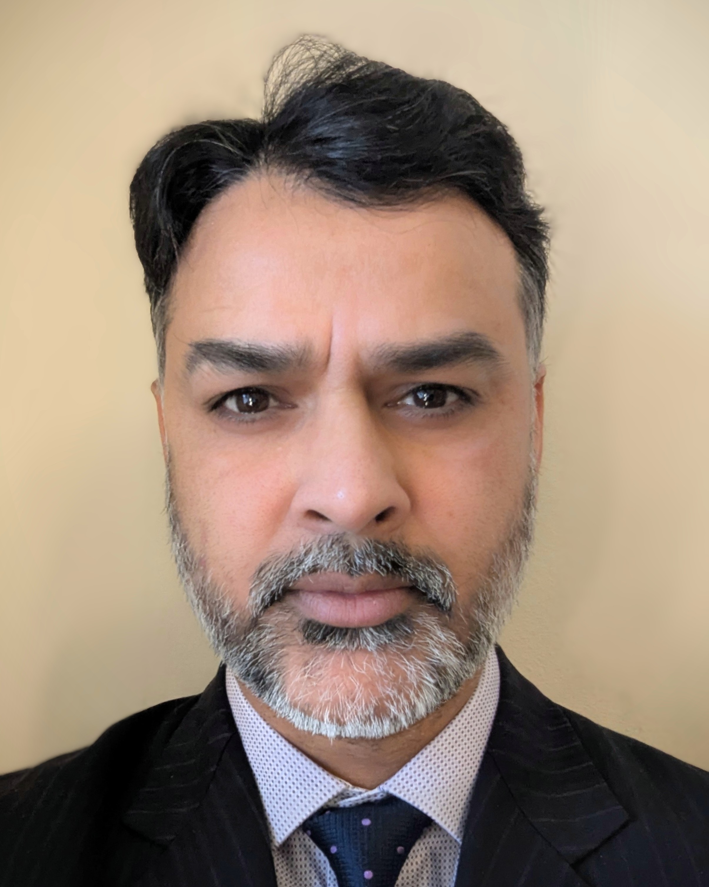 A head and shoulders portrait shot of Dr Mahmood Alam
