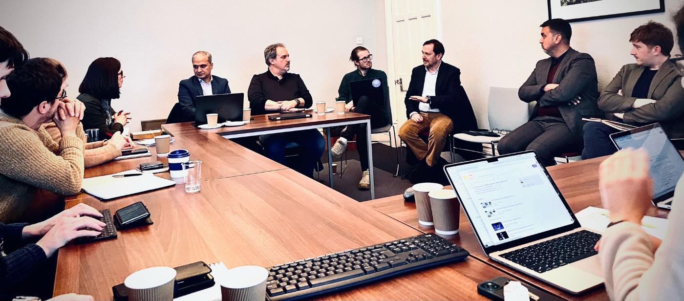 Several people at a table discussing ideas