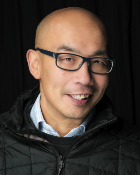 A head and shoulders portrait shot of Professor Gwo-Tzer Ho