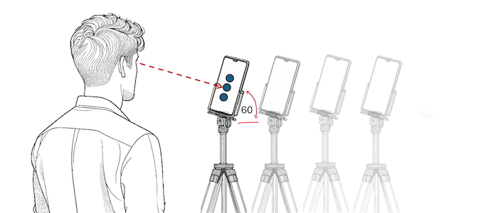 A diagram of the eye-tracking experiment the team set up showing a volunteer controlling a mobile device with their gaze at different distances