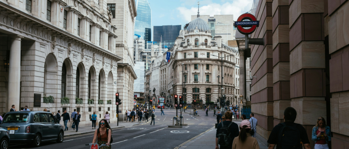 People walking and cycling through the streets of London