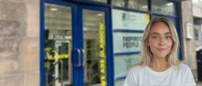 Front doors of Stevenson Gym Building with headshot of smiling woman