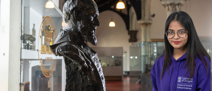 Bust of Lord Kelvin in the Hunterian Museum with headshot of smiling woman