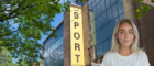 UofG Sport building sign with headshot of smiling woman