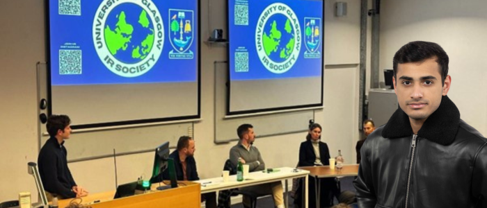 Panel of students in front of the International Relations society with headshot of smiling man