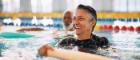 Older men exercising together in a swimming pool
