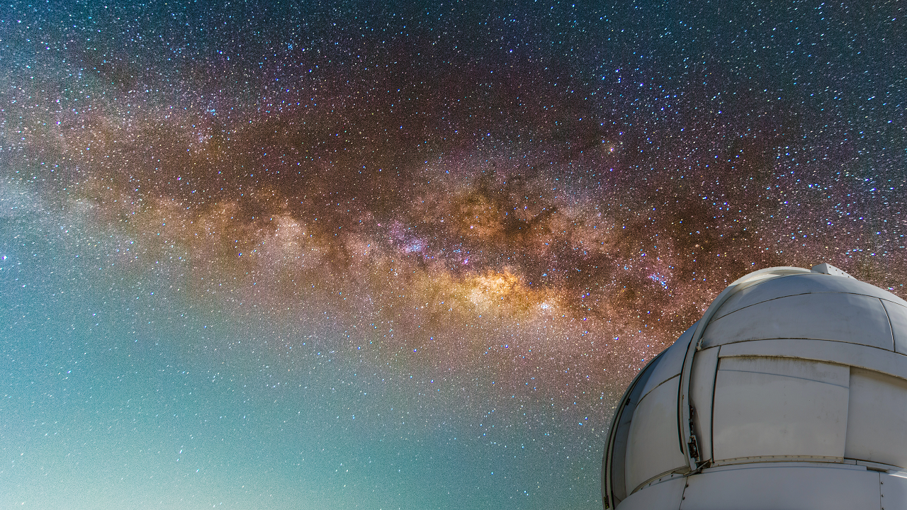 Milky way with observatory in foreground