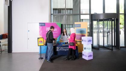 Employer speaking to student in The Plaza space in the James McCune Smith Learning Hub