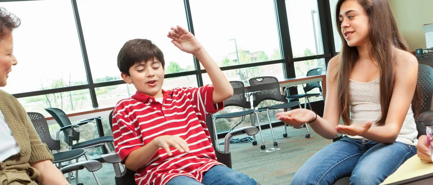 Children sitting talking in a group